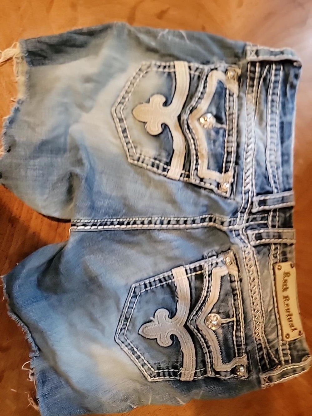 Rock Revival Women's Light Blue Distressed Denim Shorts with Embroidered Pockets
